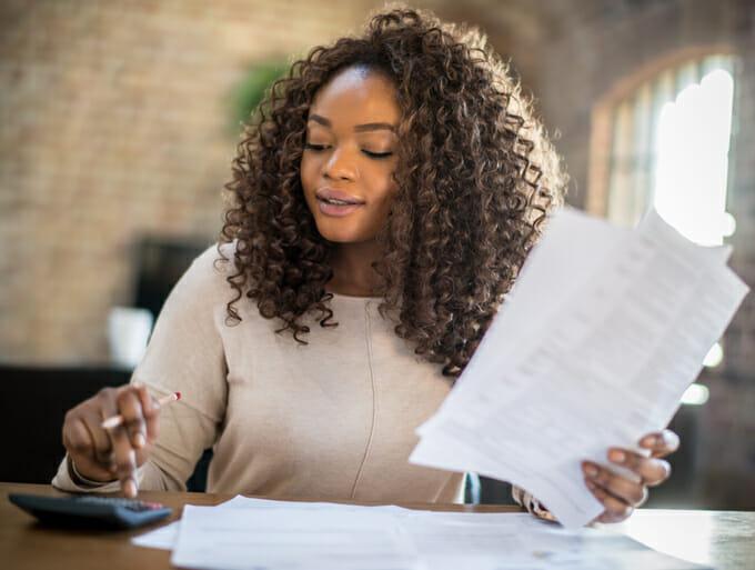 Man stressed by a foreclosure sign looking for foreclosure options